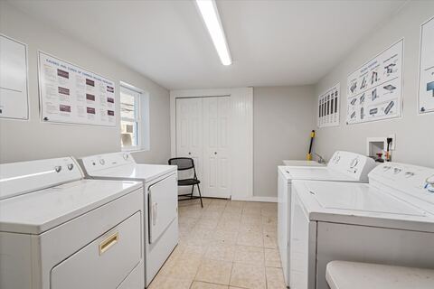 On-site laundry room with multiple washers and dryers