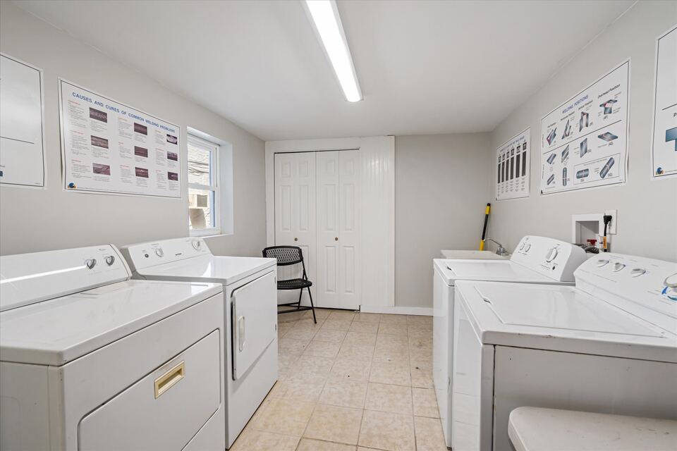 On-site laundry room at The Hatfield House with multiple washers and dryers