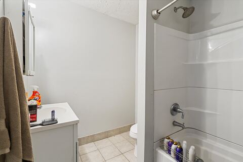 Clean bathroom with tub and shower