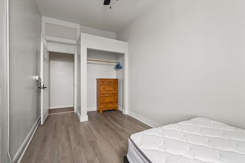 Bedroom with closet and dresser