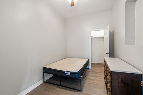 Furnished bedroom with bed and dresser after the 2024 remodel