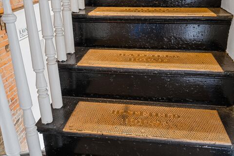 Historic painted stair treads with brass detailing