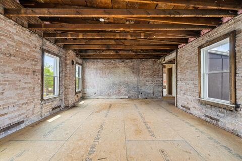 Original 1840s brickwork lining the third floor