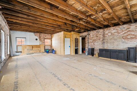 The hotel's former third-floor guest quarters with exposed brick