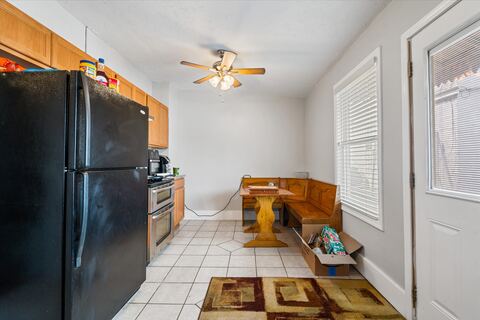 Kitchen with refrigerator and built-in bench seating