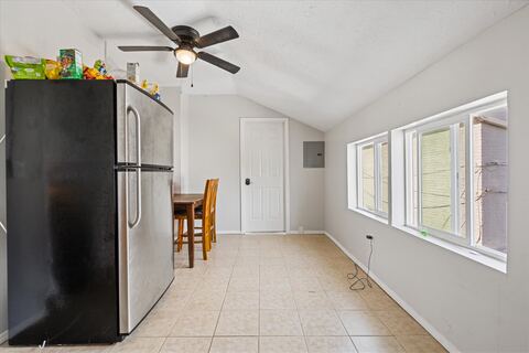 Kitchen and dining area with full-size refrigerator