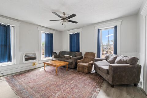 Furnished living room with gray couches and area rug