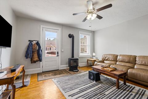 Living room with decorative stove and seating area